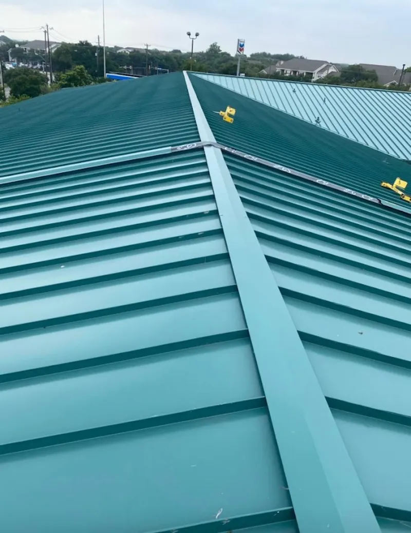 Green commercial metal roof ridge and valley for Metal Roof Repair in Butler